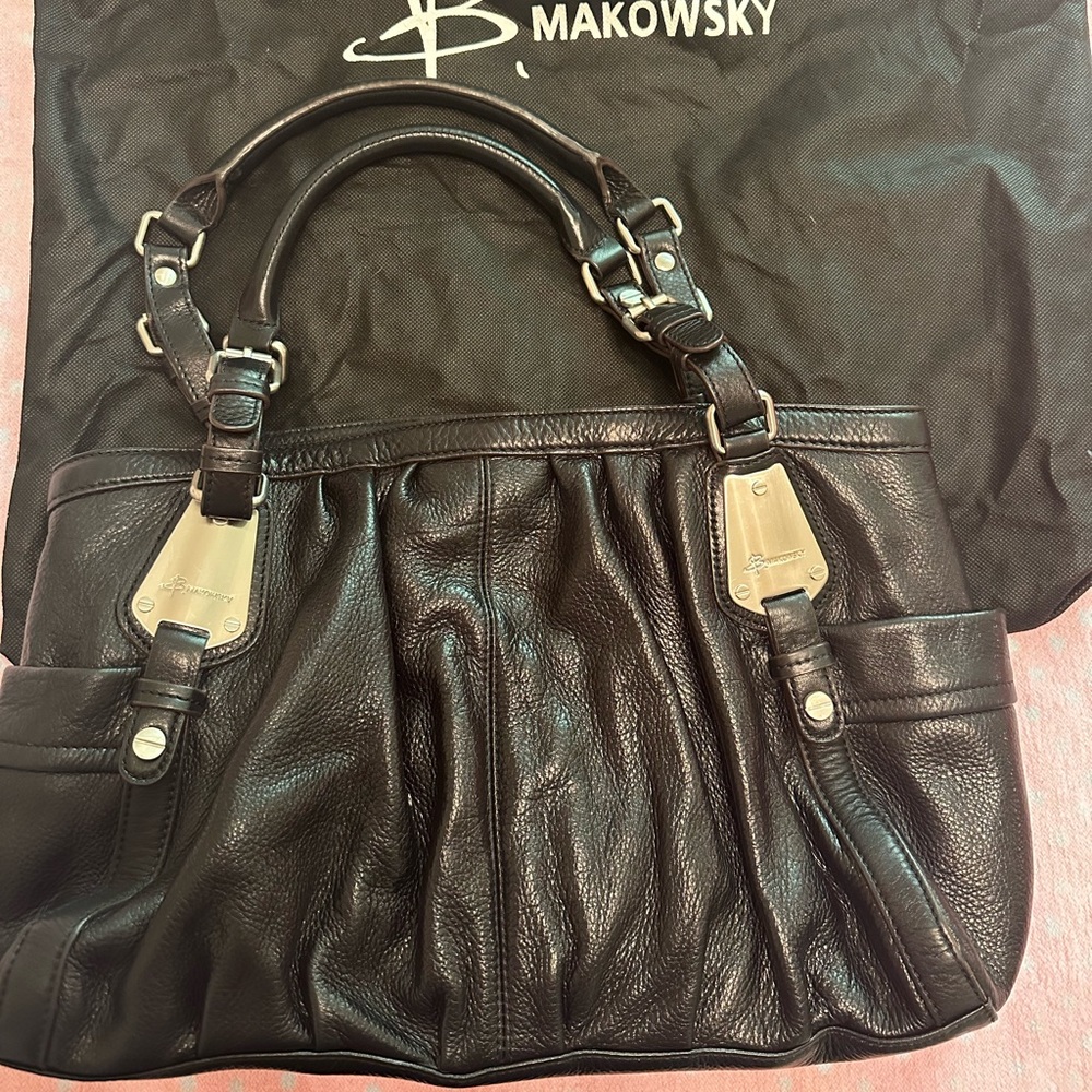 B. Makowsky Large Black Leather Shoulder Bag with zipper and grommet accents